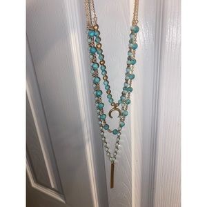 Blue layered necklaces with gold accents